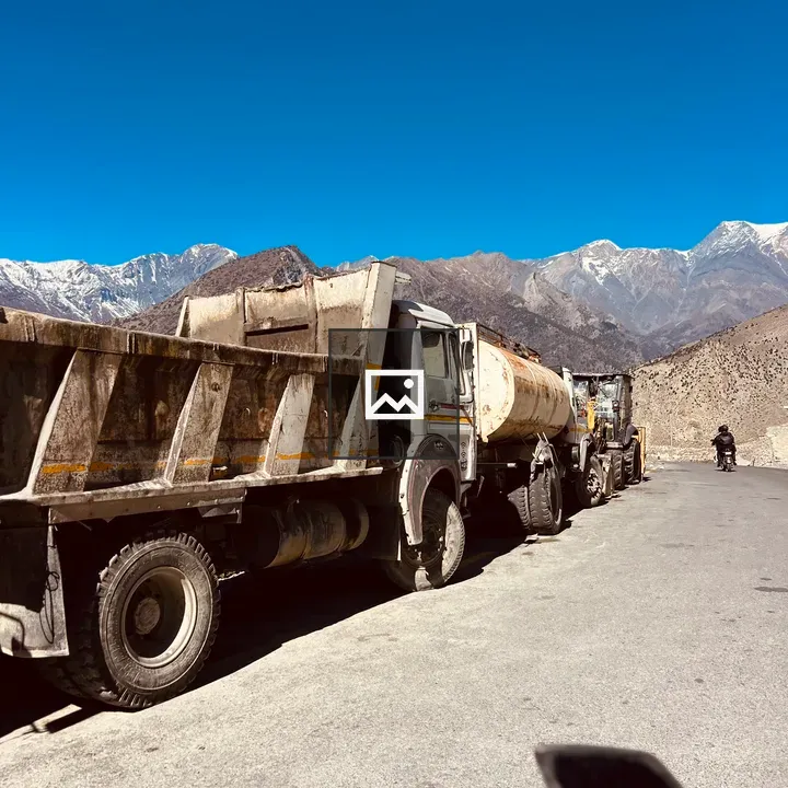 Construction trucks on snowy road