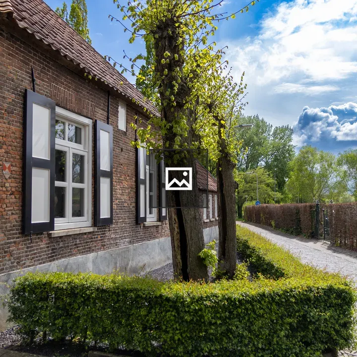 Corner of old house with trees