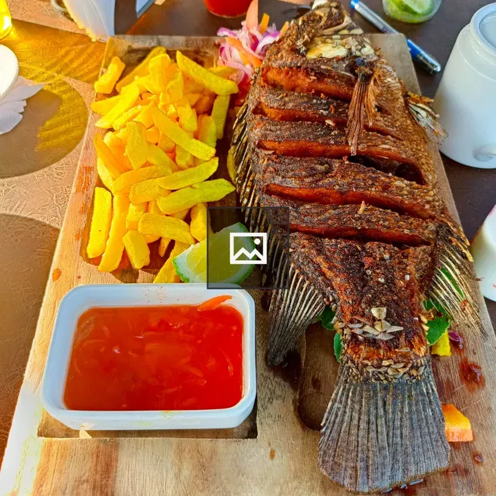 Whole fried tilapia with fries