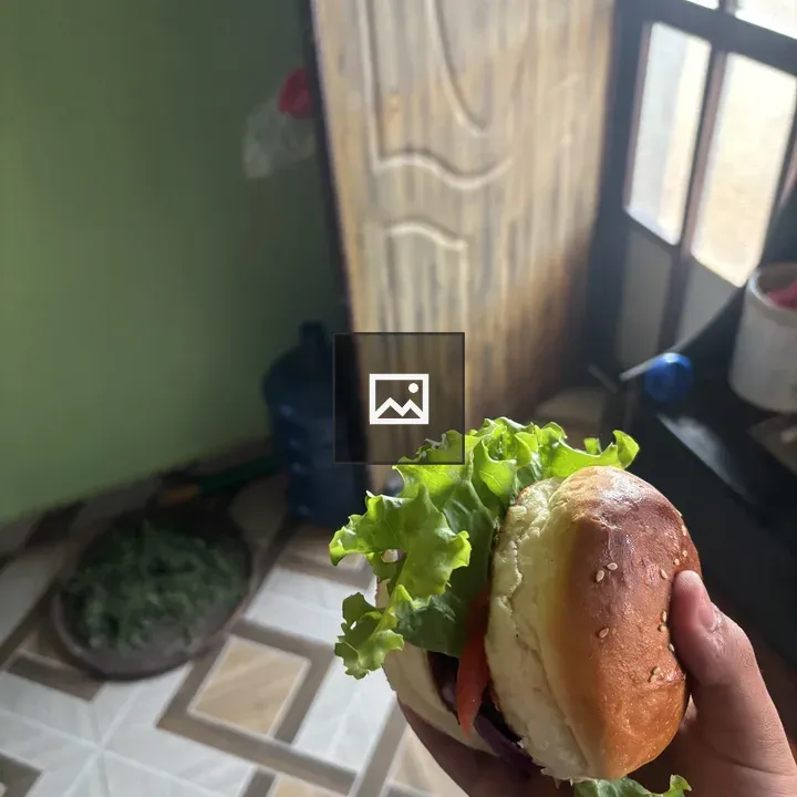 Hamburger in Hand with Door Background