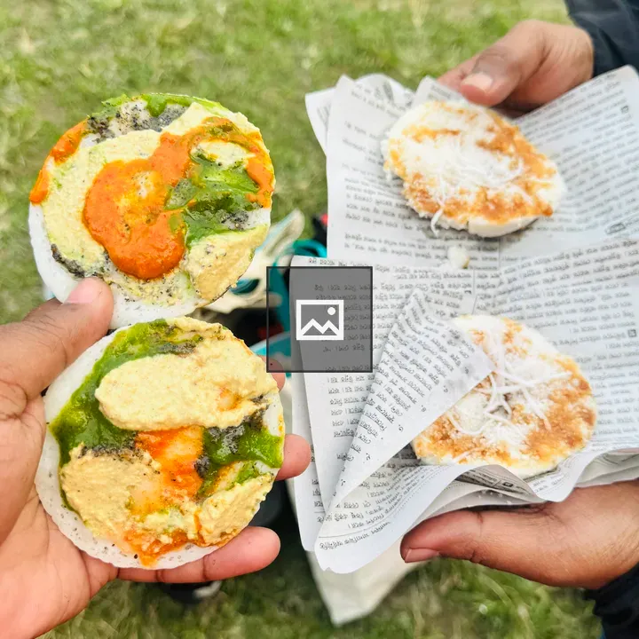 Hands holding rice cakes in field