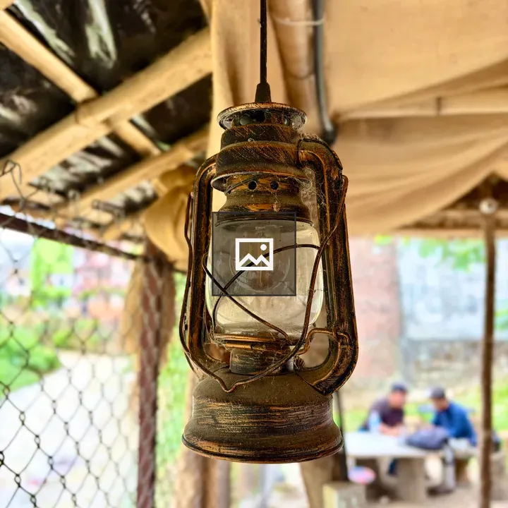 Rustic lantern under wooden roof