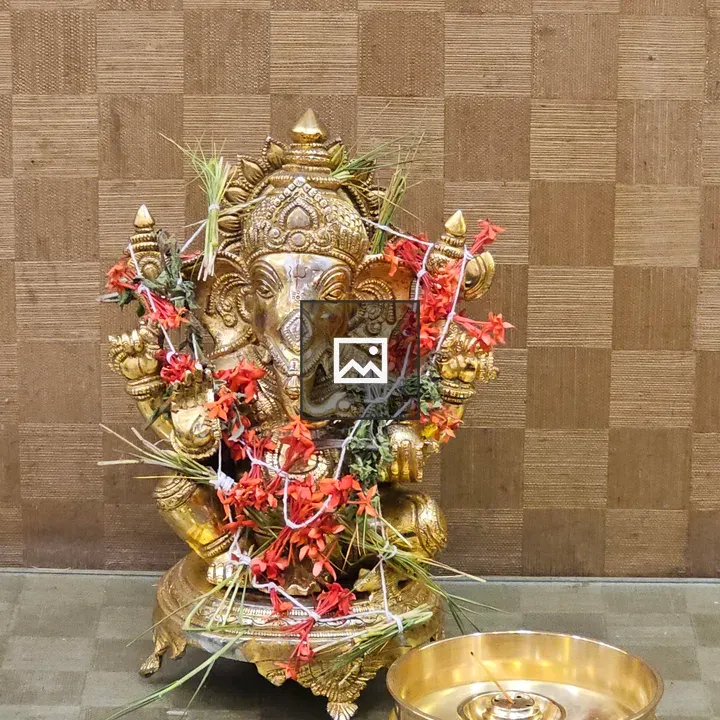 Brass Ganesh Idol with Flowers