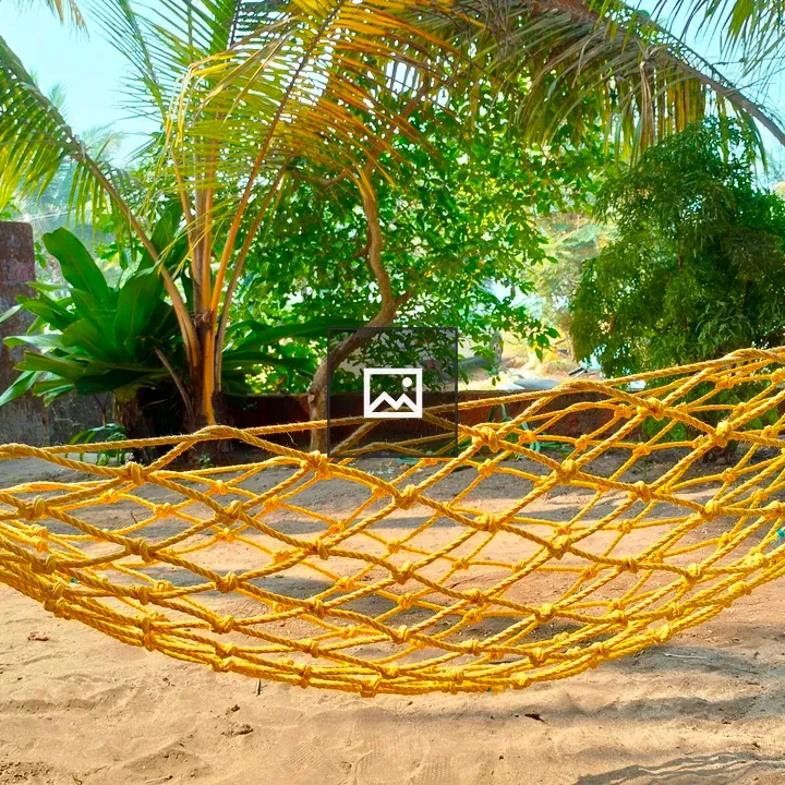Beach cradle under coconut tree