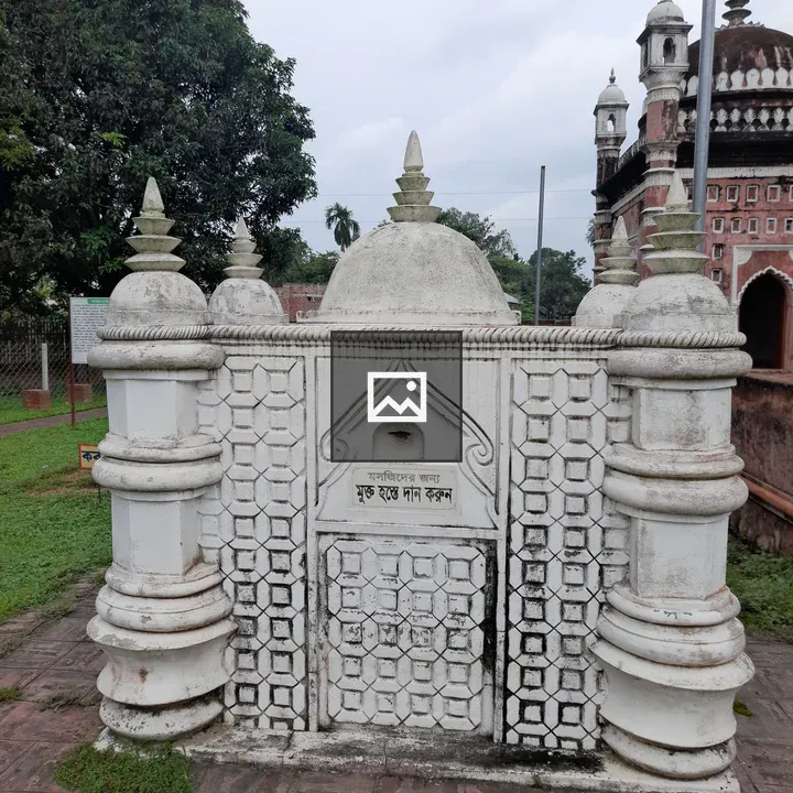 Ornate white tomb with domed spires