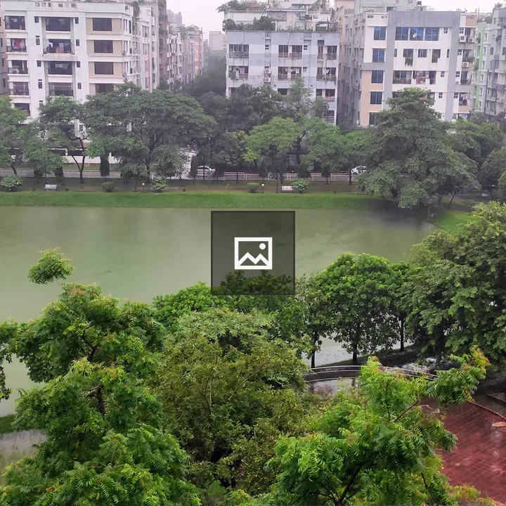 Urban pond with surrounding buildings