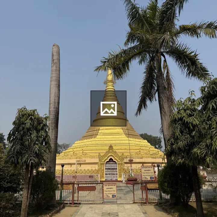 Golden stupa with palm trees