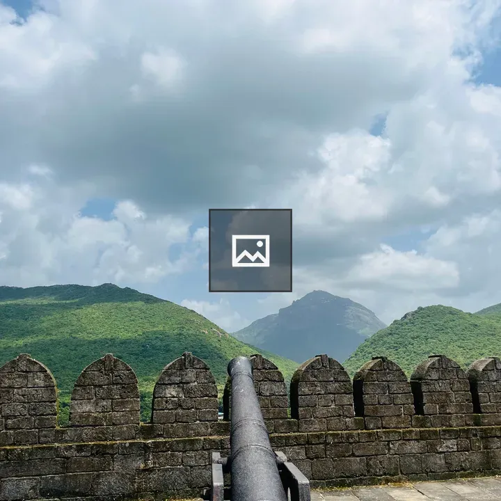 Historic stone wall with cannon