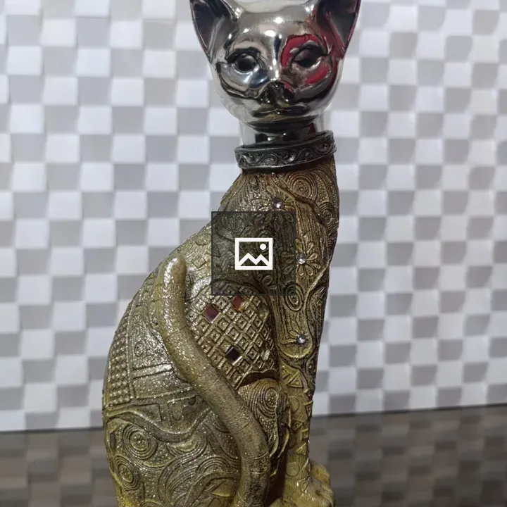 Cat sculpture with ornate patterns