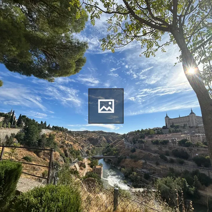 Winding river landscape with hilltop building