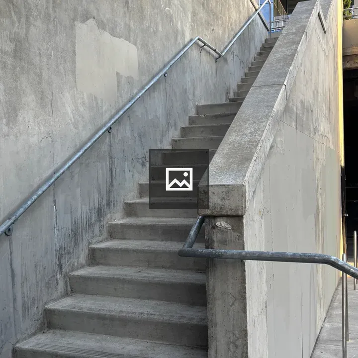 Concrete stairs with rail and glass