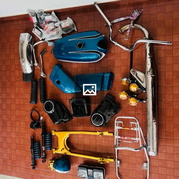 Motorcycle parts on red tiles