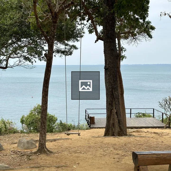 Water view with swing and deck