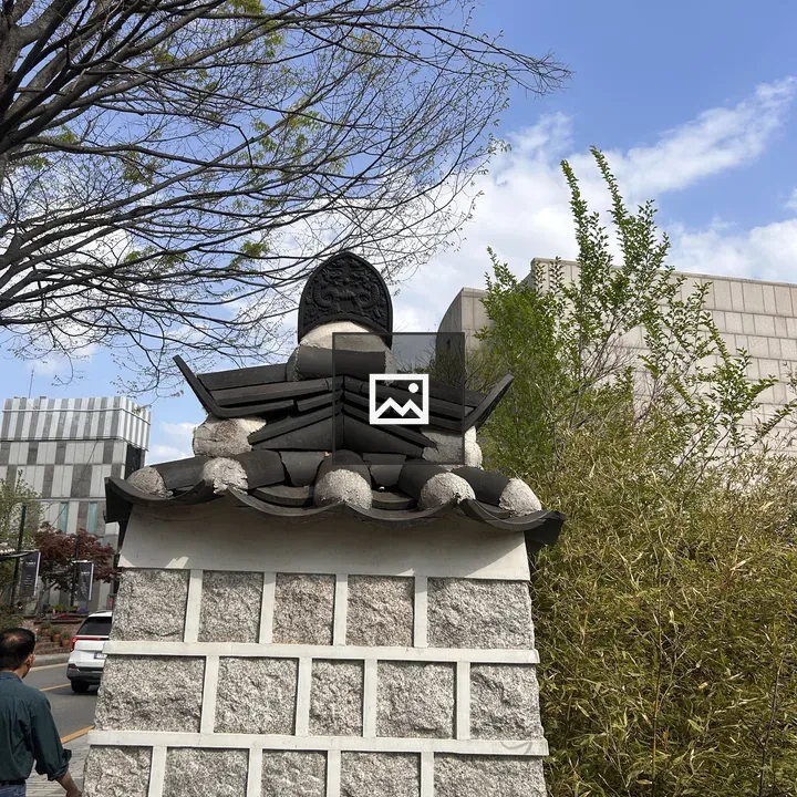 Decorative stone wall with tiled roof