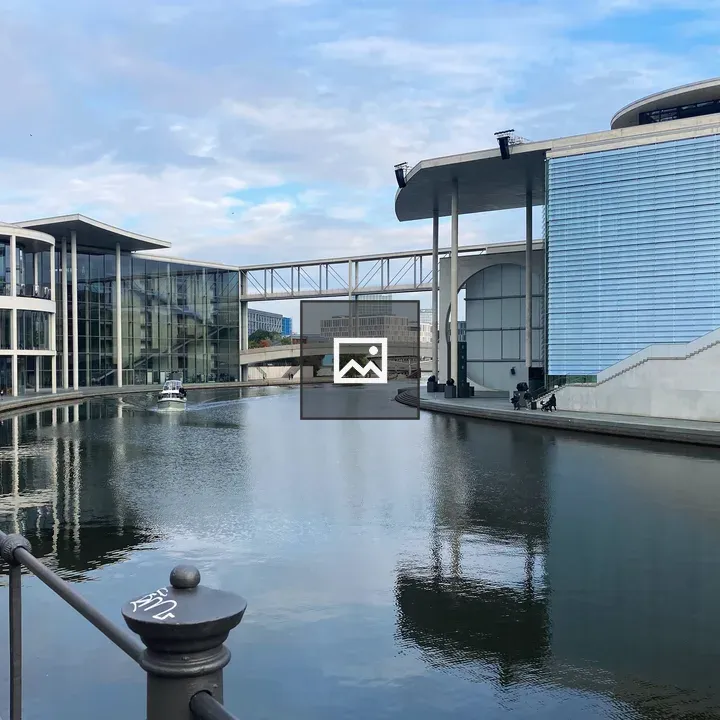 Calm canal with modern buildings