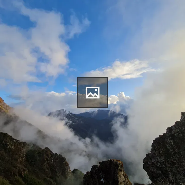 Massive mountains under blue sky