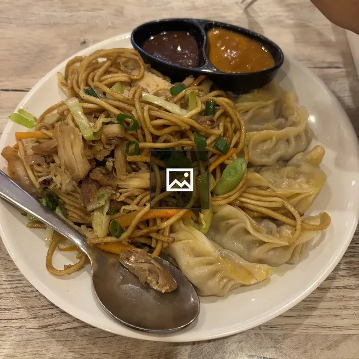 Plate of noodles with dumplings