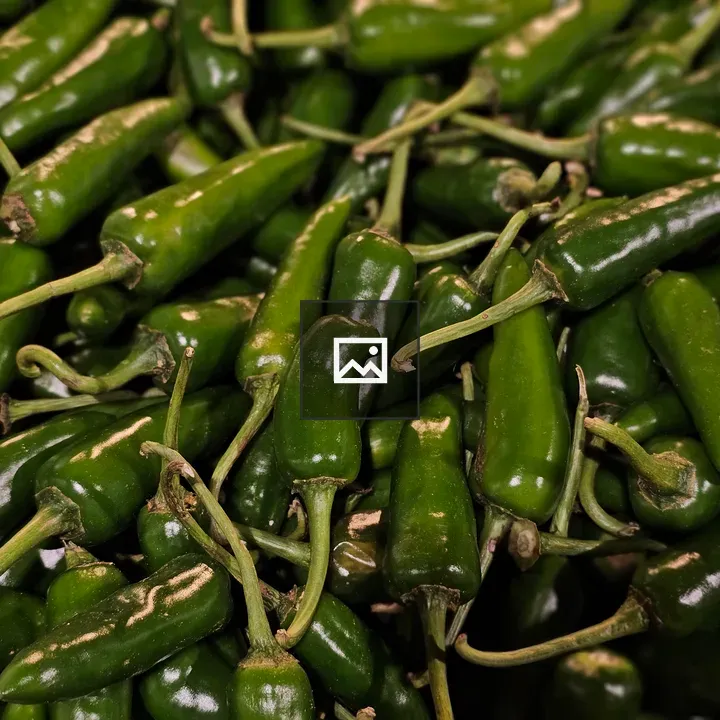 Green chilies in market display