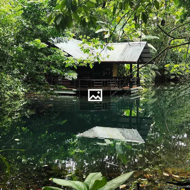Small wooden cabin by water