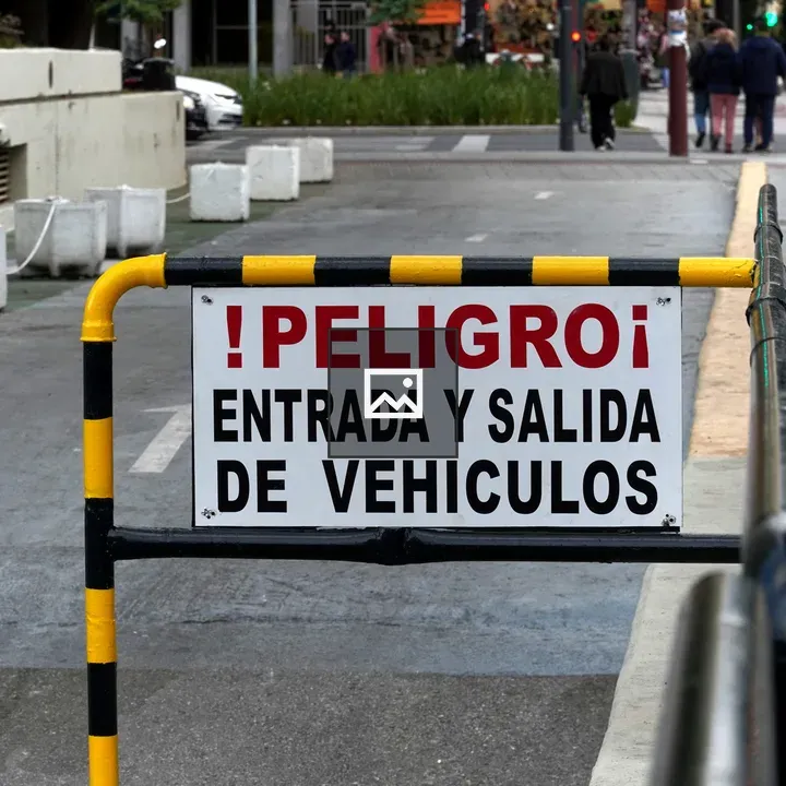 Peligro sign on city barrier