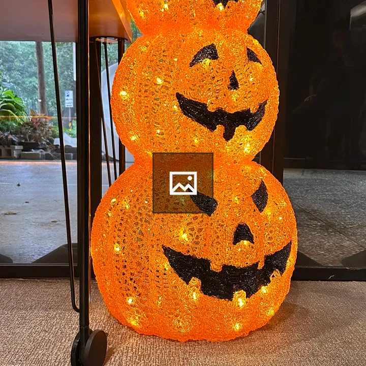 Stacked illuminated pumpkins display