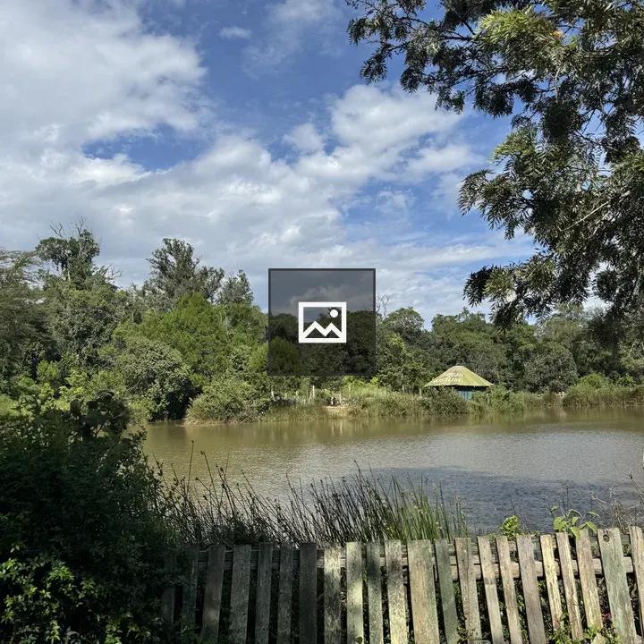 Pond with fence and hut