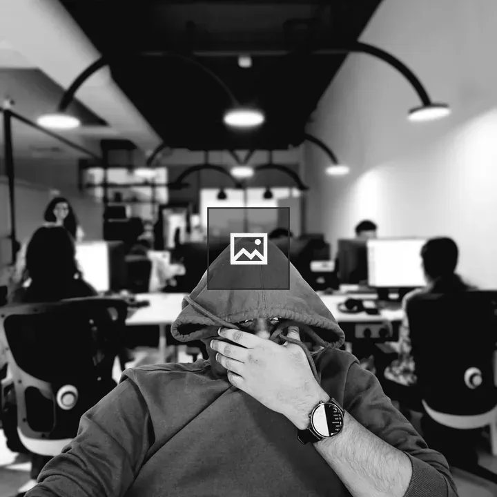 Man Facing Camera Across Table