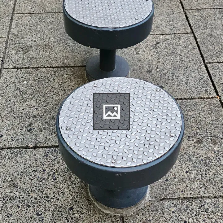 Two metal-topped stools