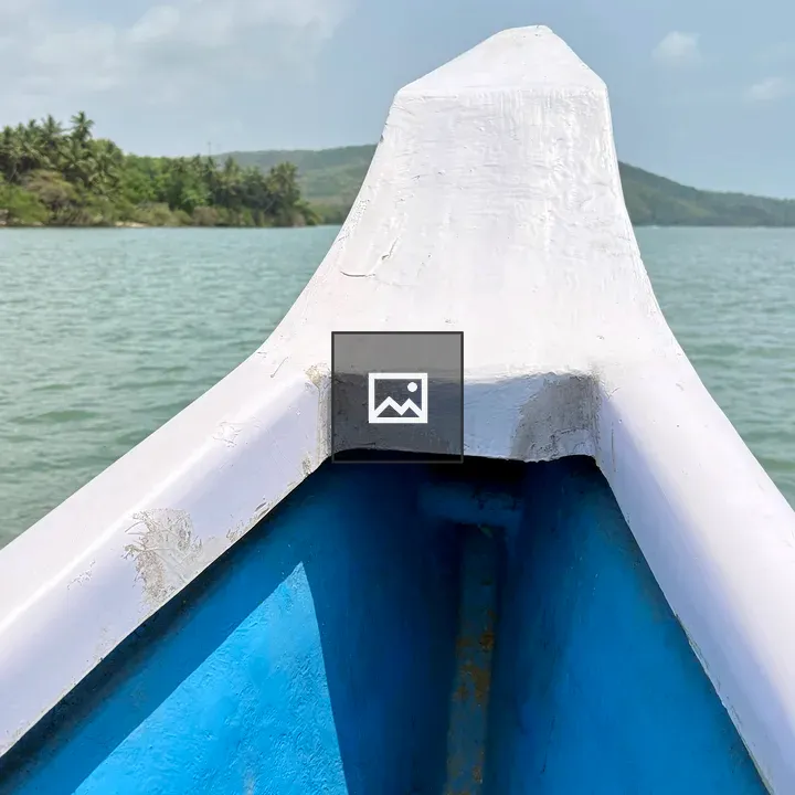 Boat on calm lake with hills