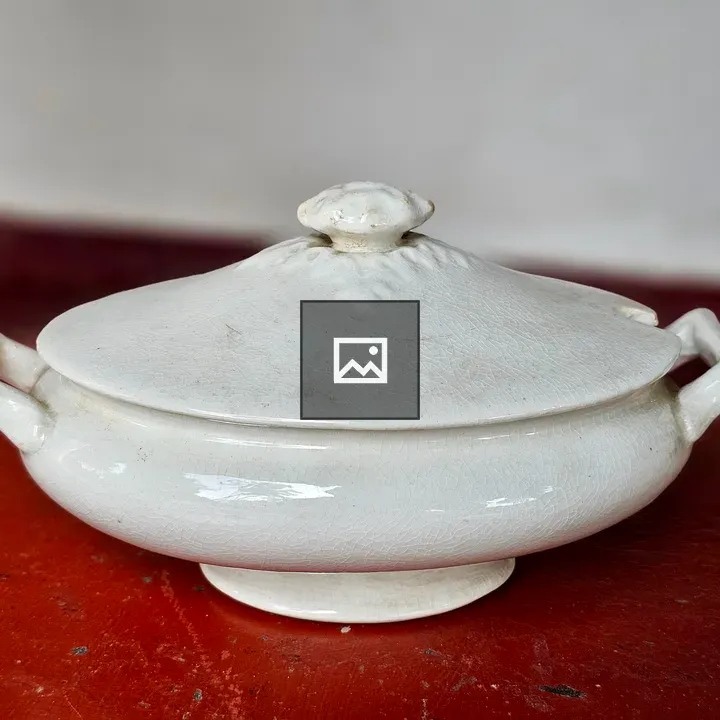 White ceramic serving bowl with lid