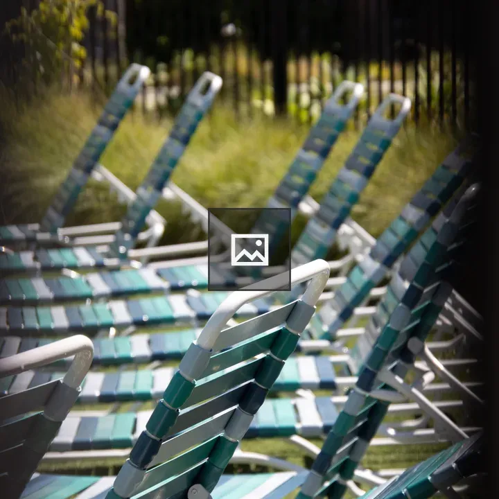 Row of empty pool chairs