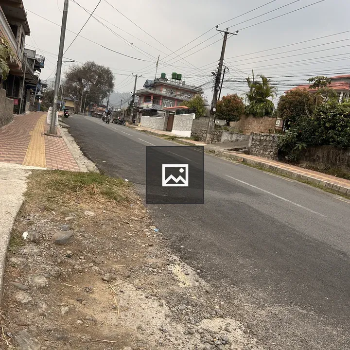 Street scene with sidewalk and poles