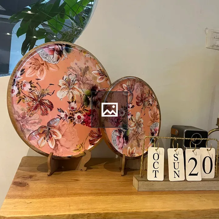 Two pink floral decorative plates