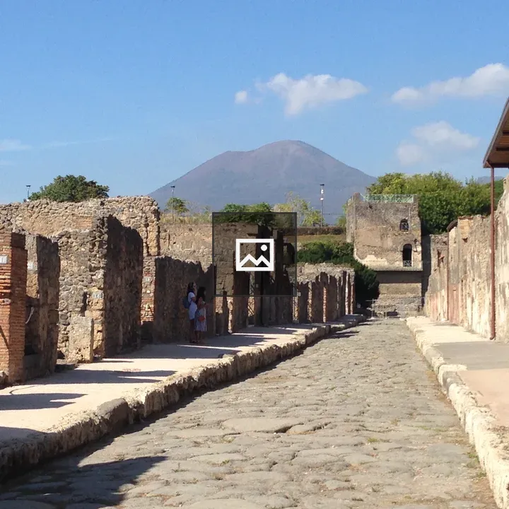 Roman ruins with Vesuvius in background
