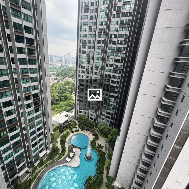 Aerial view of two residential towers with pool
