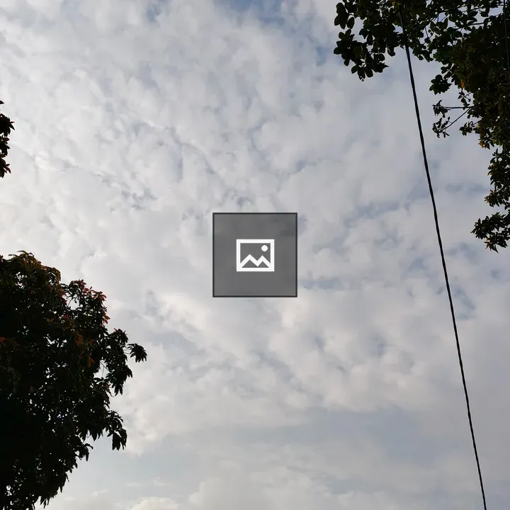 Cloudy Sky Over Blue Horizon