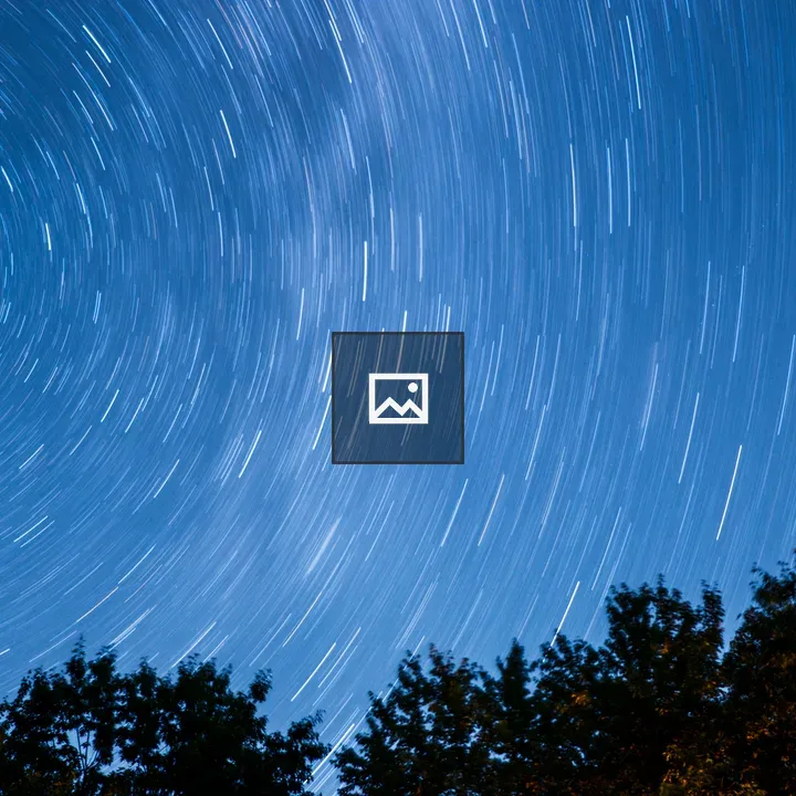 Star trails over Maine woods
