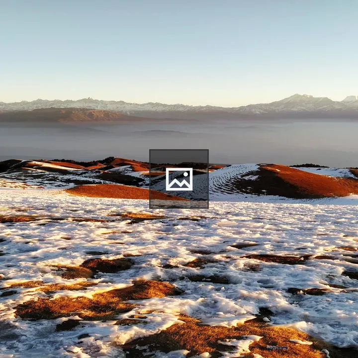 Sunrise Perspective Over Snowy Landscape