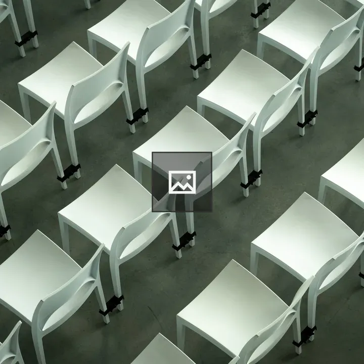 Rows of White Plastic Chairs