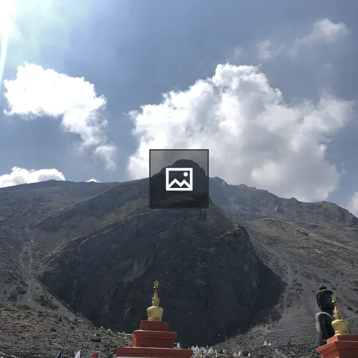 Two white stupas with golden spires