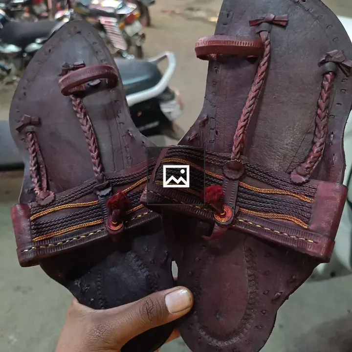 Person with Kolhapuri sandals