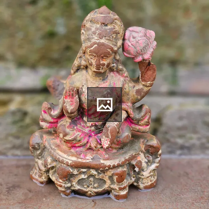 Broken clay idol of Lakshmi