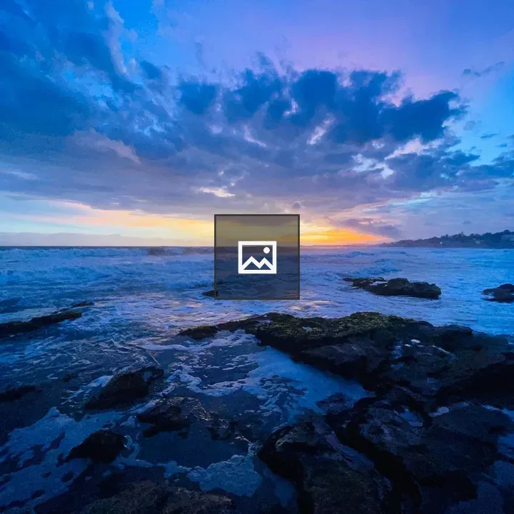 Sunrise over waves on water