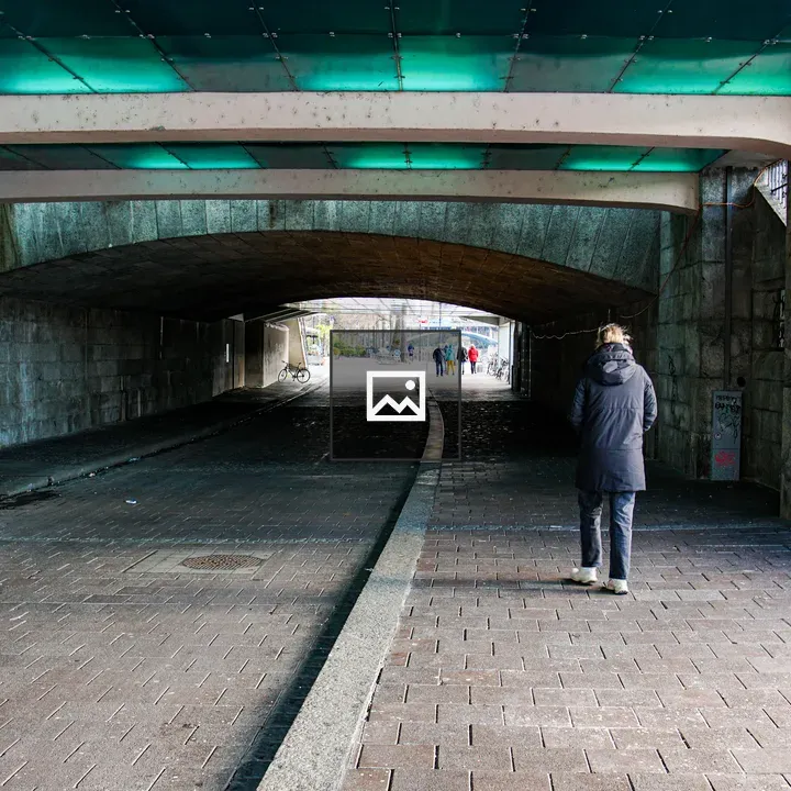 Person Walking Through Underpass
