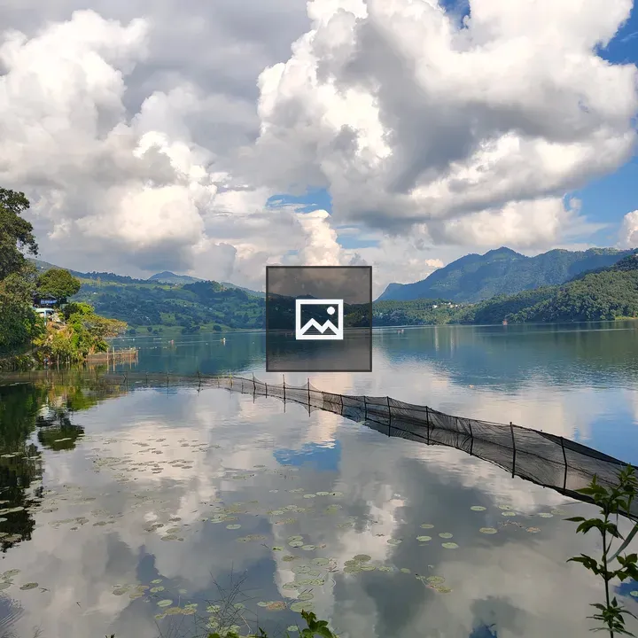 Lake scene with clouds and hills