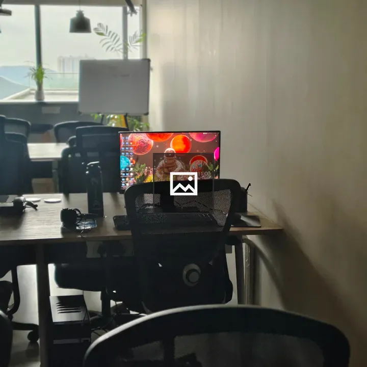 Bright computer screen in a drab room
