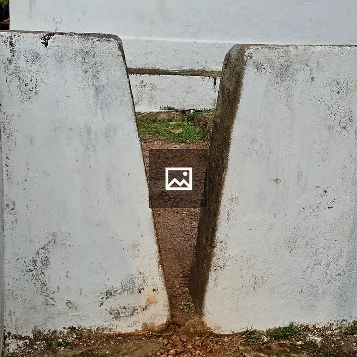 Narrow Gap Between White Walls