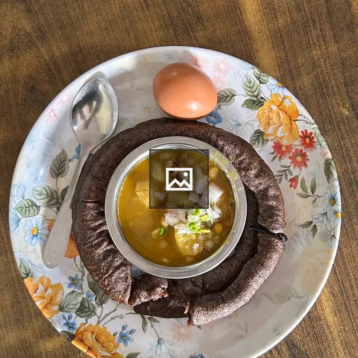 Floral plate with lentil curry
