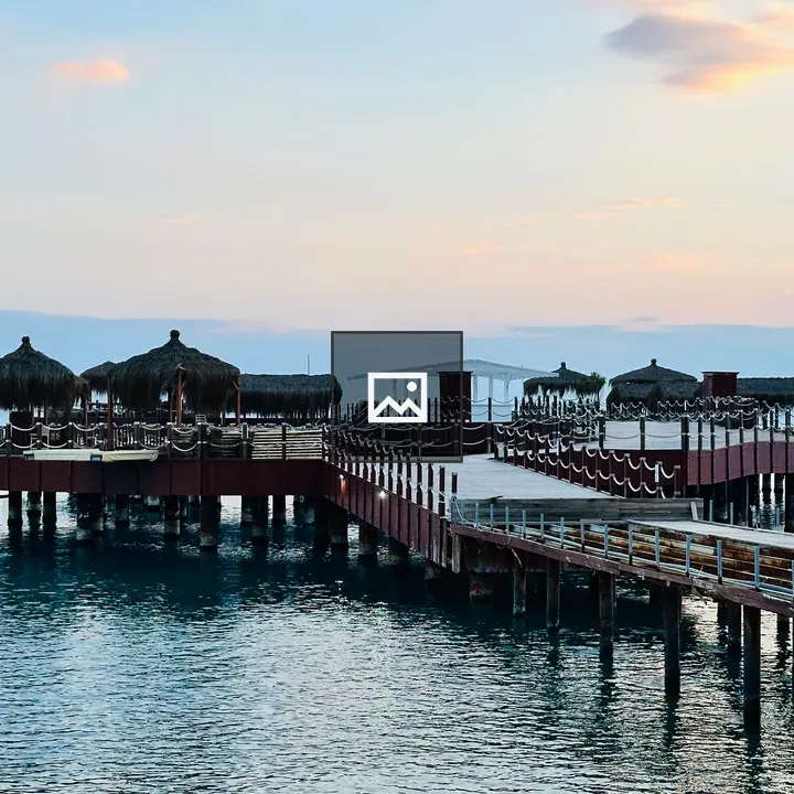 Wooden Pier with Thatched Structures