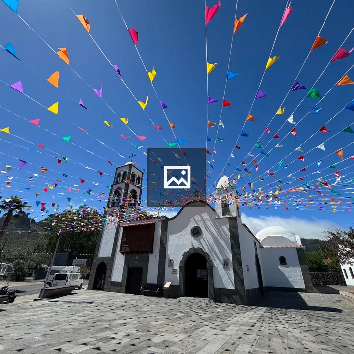 White church with flags in Tenerife plaza